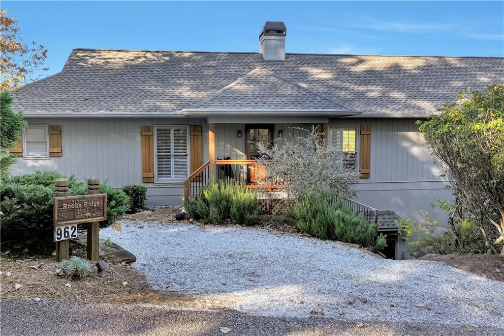 962 Woodbrier Sautee Nacoochee, GA 30571 - Photo 2 of 52 a front view of a house with garden