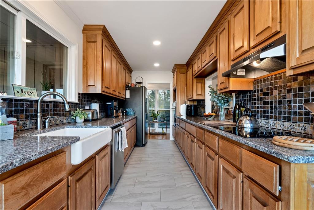962 Woodbrier Sautee Nacoochee, GA 30571 - Photo 21 of 52 a kitchen with kitchen island granite countertop lots of counter top space and stainless steel appliances