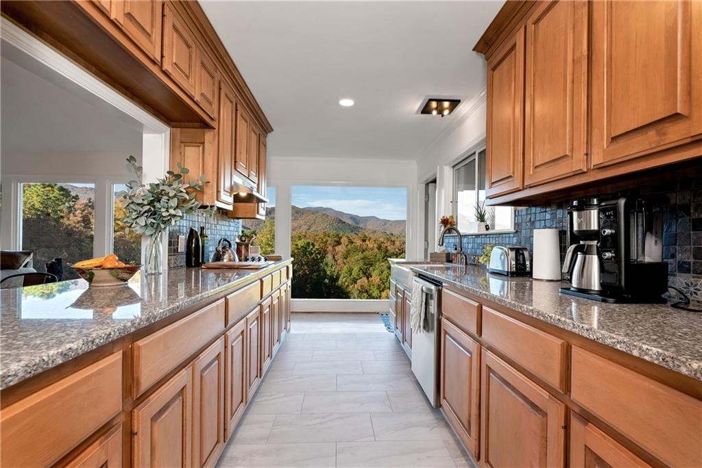 962 Woodbrier Sautee Nacoochee, GA 30571 - Photo 22 of 52 a large kitchen with stainless steel appliances granite countertop a sink and cabinets