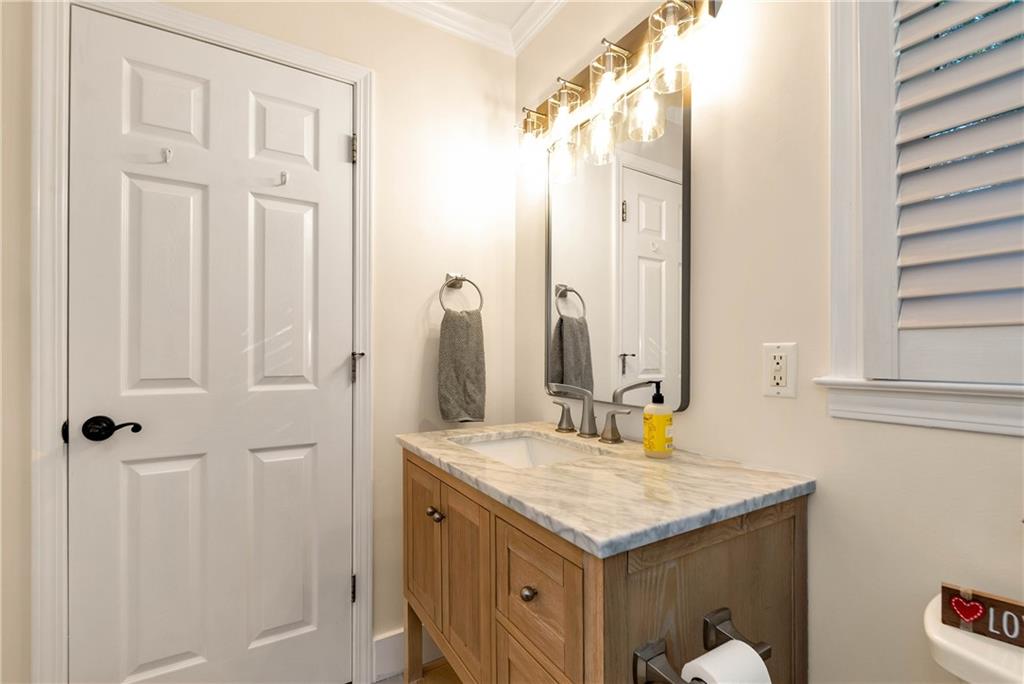 962 Woodbrier Sautee Nacoochee, GA 30571 - Photo 33 of 52 a bathroom with a granite countertop sink and a mirror