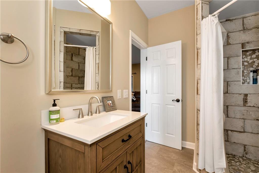 962 Woodbrier Sautee Nacoochee, GA 30571 - Photo 45 of 52 a bathroom with a sink vanity and a mirror