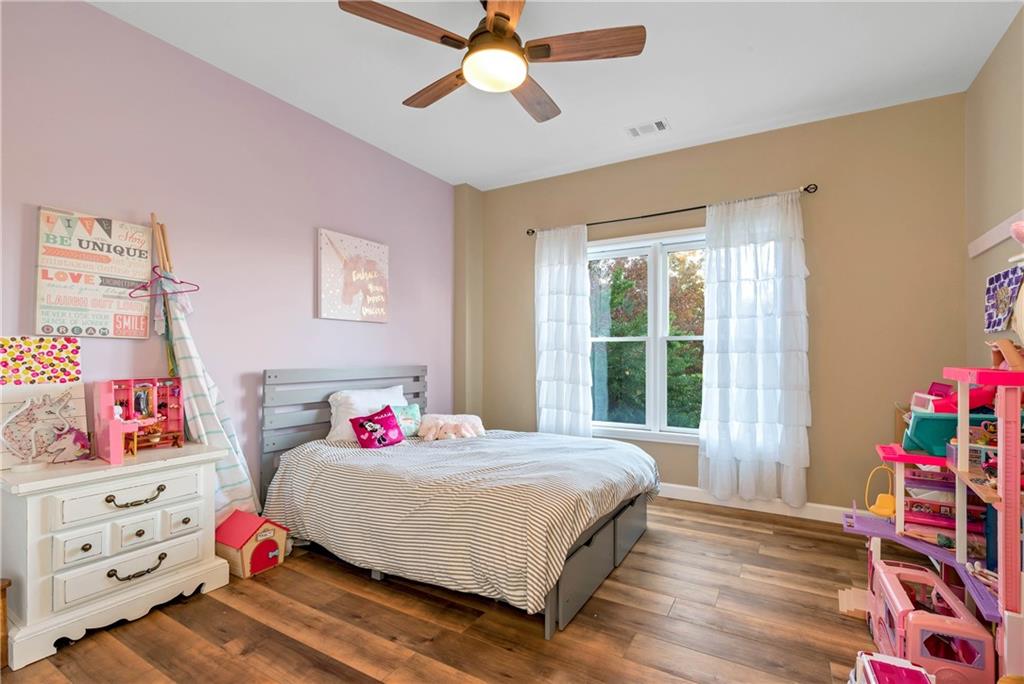 962 Woodbrier Sautee Nacoochee, GA 30571 - Photo 48 of 52 a bedroom with a bed and wooden floor