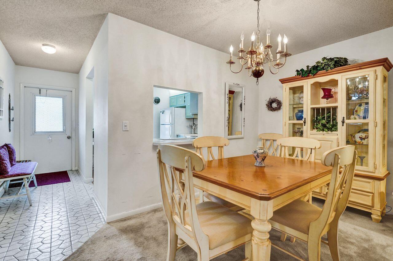 282 Cape Cod Circle, Unit A Lake Worth, FL 33467 - Photo 5 of 31 Dining Area to Kitchen and Foyer