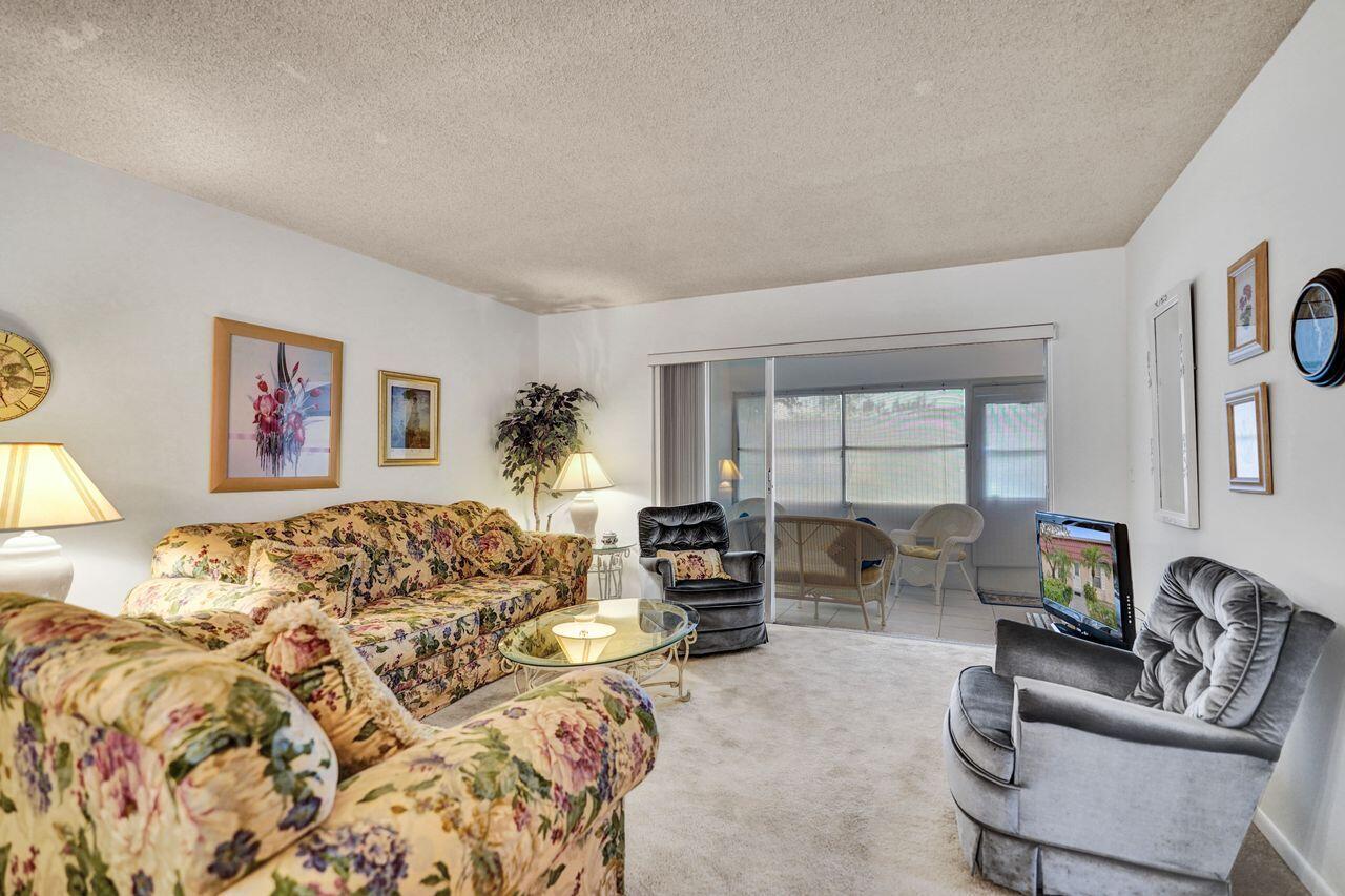 282 Cape Cod Circle, Unit A Lake Worth, FL 33467 - Photo 9 of 31 Living Room to Patio