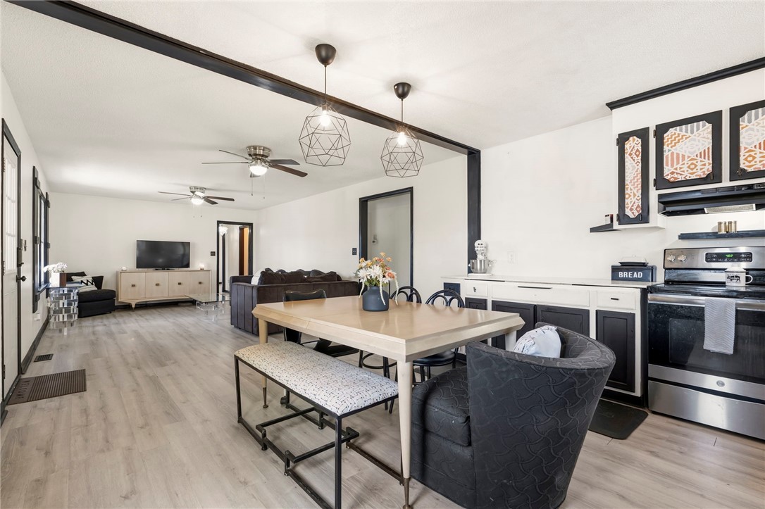 122 Latham Drive Anderson, SC 29621 - Photo 13 of 39 This versatile space seamlessly combines kitchen, dining, and living areas for modern living.