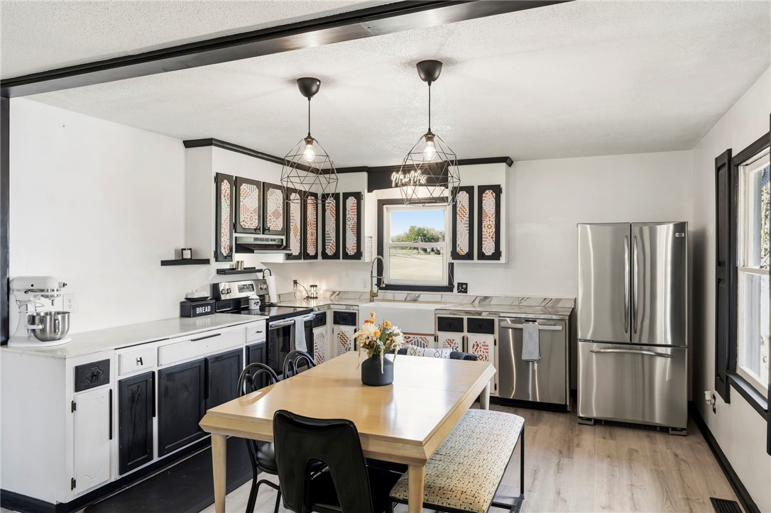 122 Latham Drive Anderson, SC 29621 - Photo 14 of 39 This spacious kitchen offers a delightful cooking and dining experience with ample natural light.