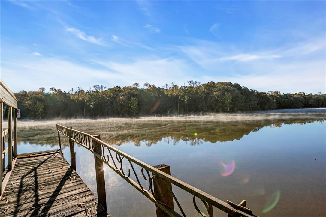 122 Latham Drive Anderson, SC 29621 - Photo 32 of 39 Embrace peaceful lakeside living with direct access to serene waters from your private dock.