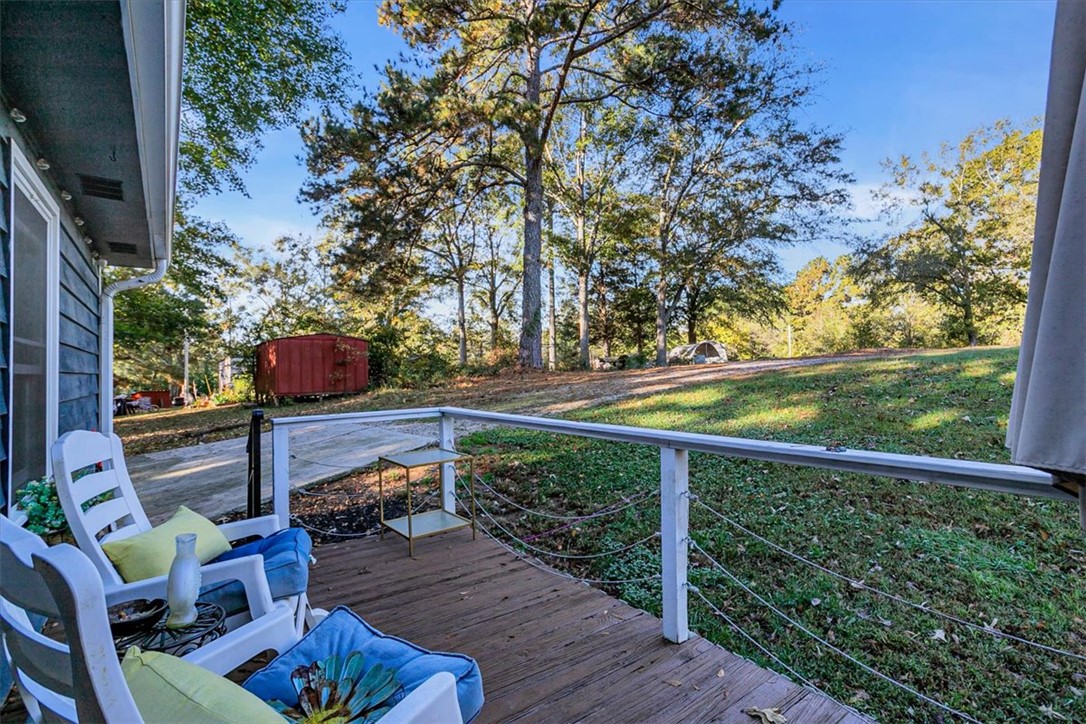 122 Latham Drive Anderson, SC 29621 - Photo 38 of 39 This inviting patio offers a serene outdoor escape amidst nature's embrace.