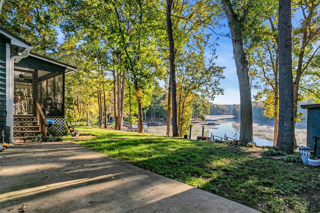 122 Latham Drive Anderson, SC 29621 - Photo 8 of 39 This tranquil lakeside retreat offers a serene escape with beautiful views.