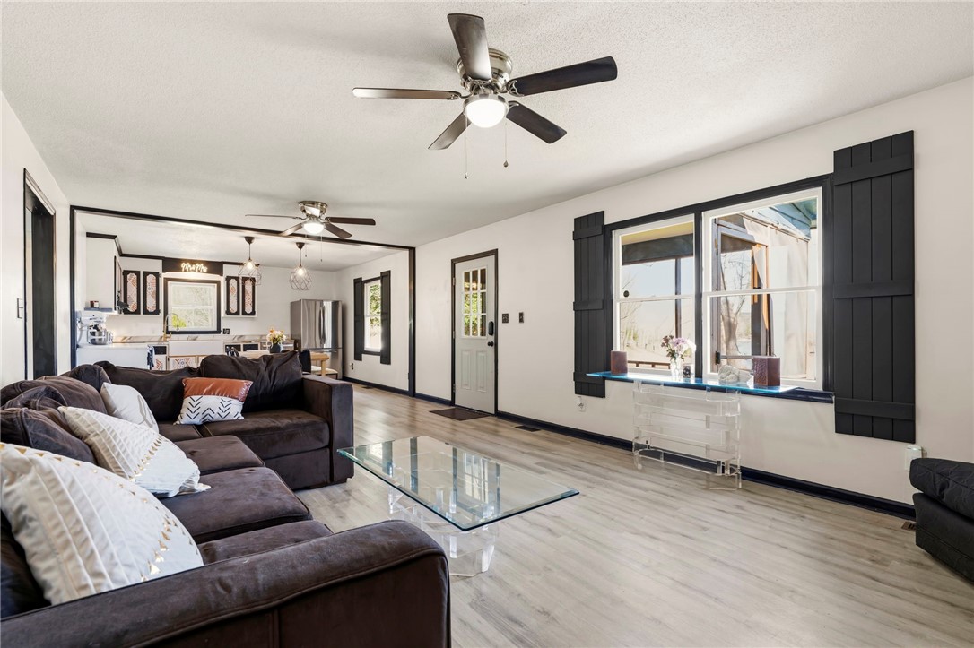 122 Latham Drive Anderson, SC 29621 - Photo 10 of 39 This bright and airy living area features sleek flooring and a contemporary open layout.