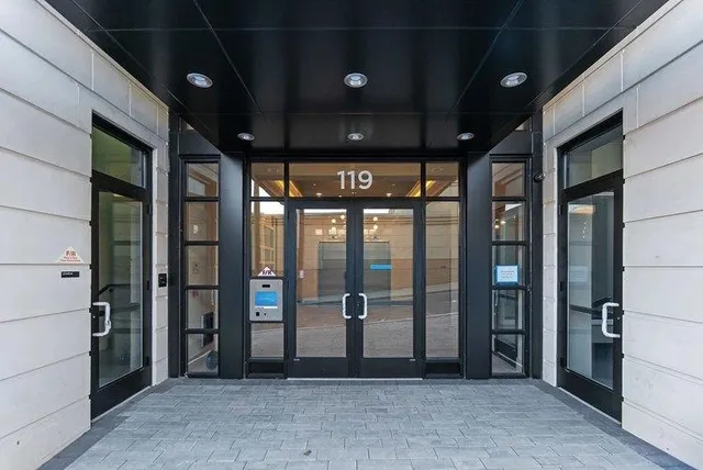 a view of a building with glass door