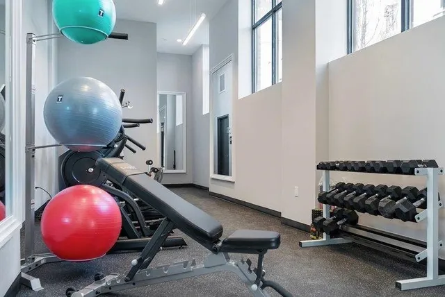 an entrance to house with wooden floor