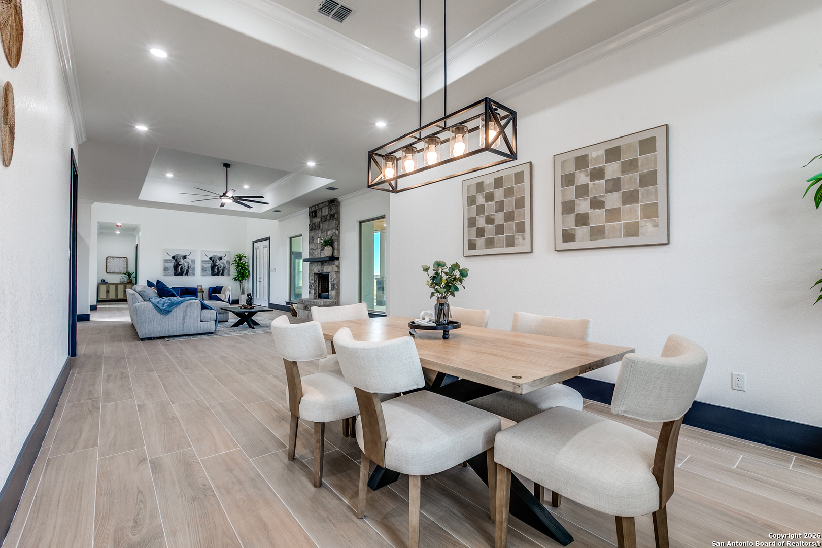 202 Venado Oaks Rio Medina, TX 78066 - Photo 12 of 37 a view of a dining room with furniture and wooden floor