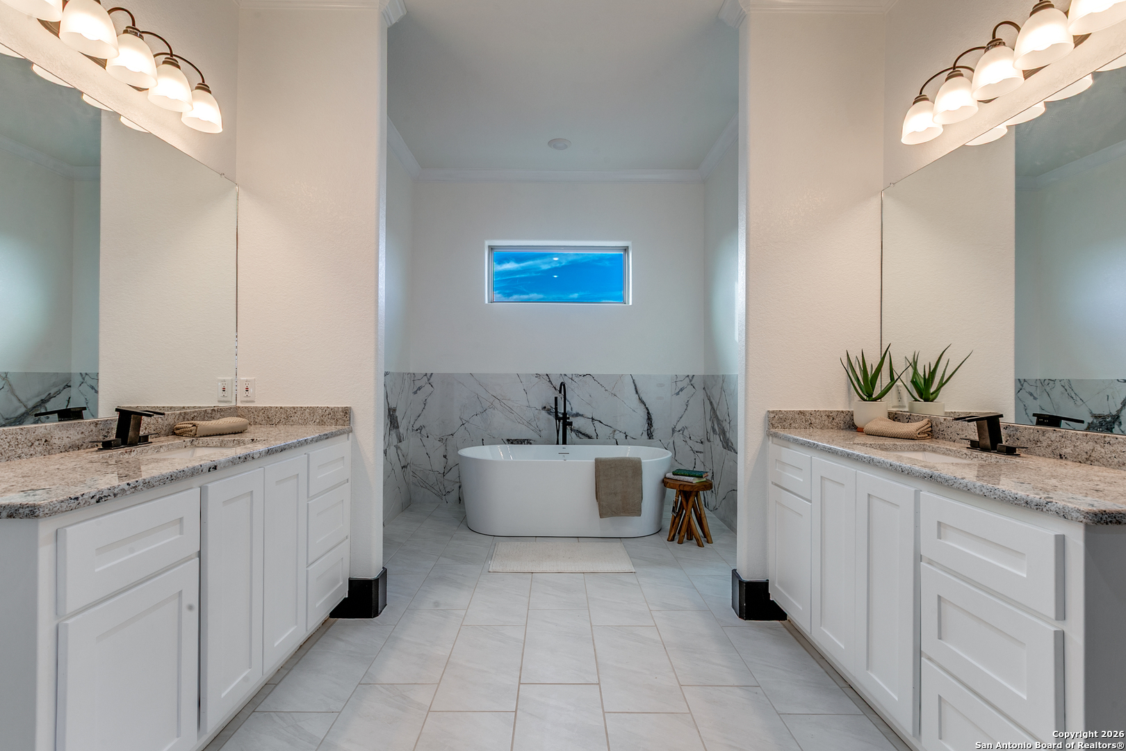202 Venado Oaks Rio Medina, TX 78066 - Photo 18 of 37 a spacious bathroom with a granite countertop sink and a bathtub