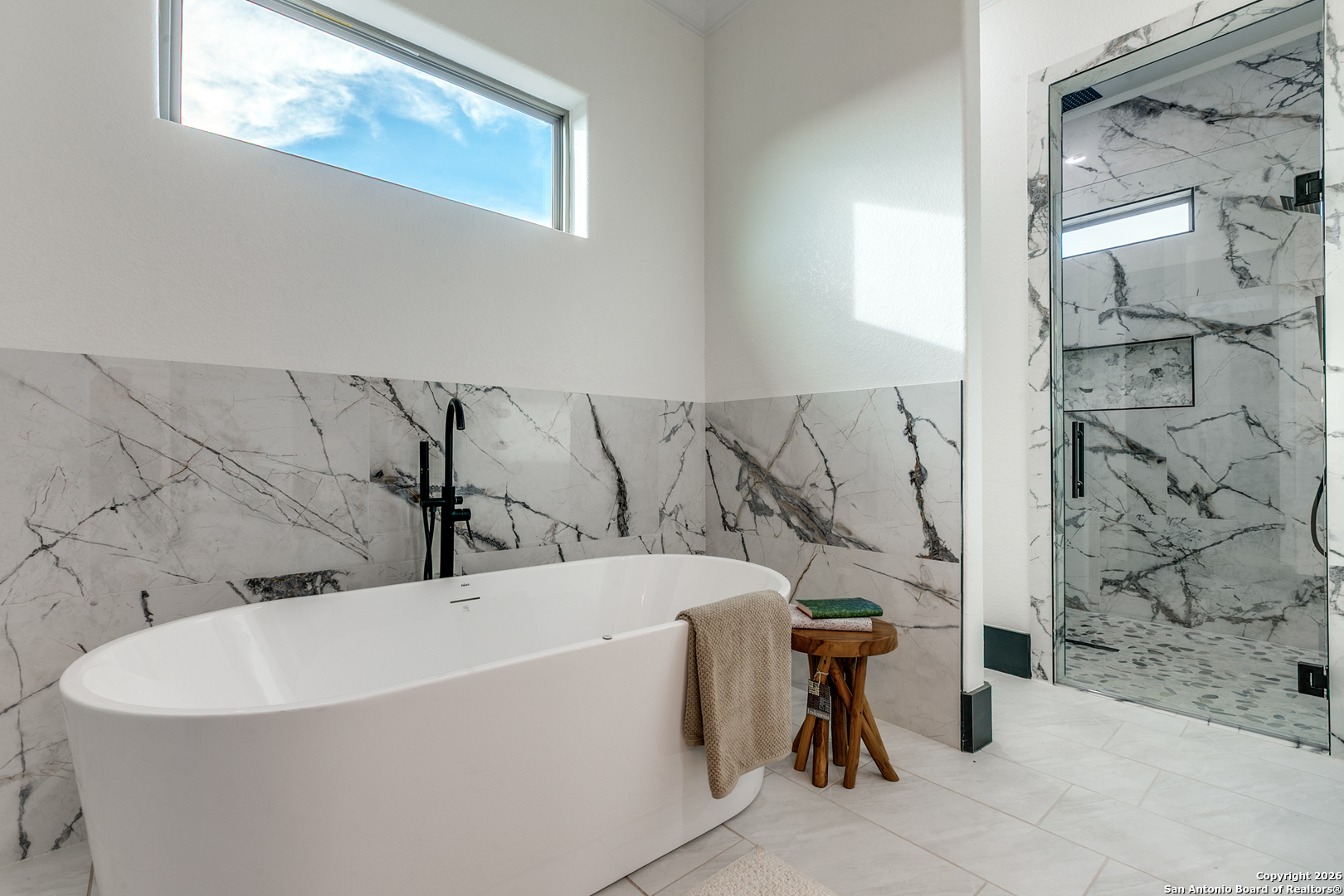 202 Venado Oaks Rio Medina, TX 78066 - Photo 19 of 37 a bathroom with a bathtub and shower
