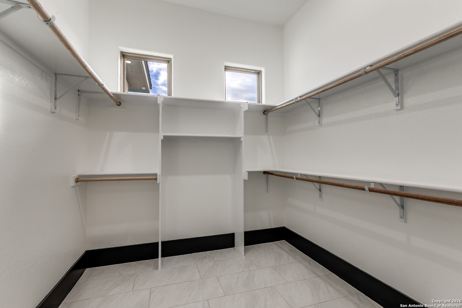 202 Venado Oaks Rio Medina, TX 78066 - Photo 27 of 37 a view of walk in closet with empty racks