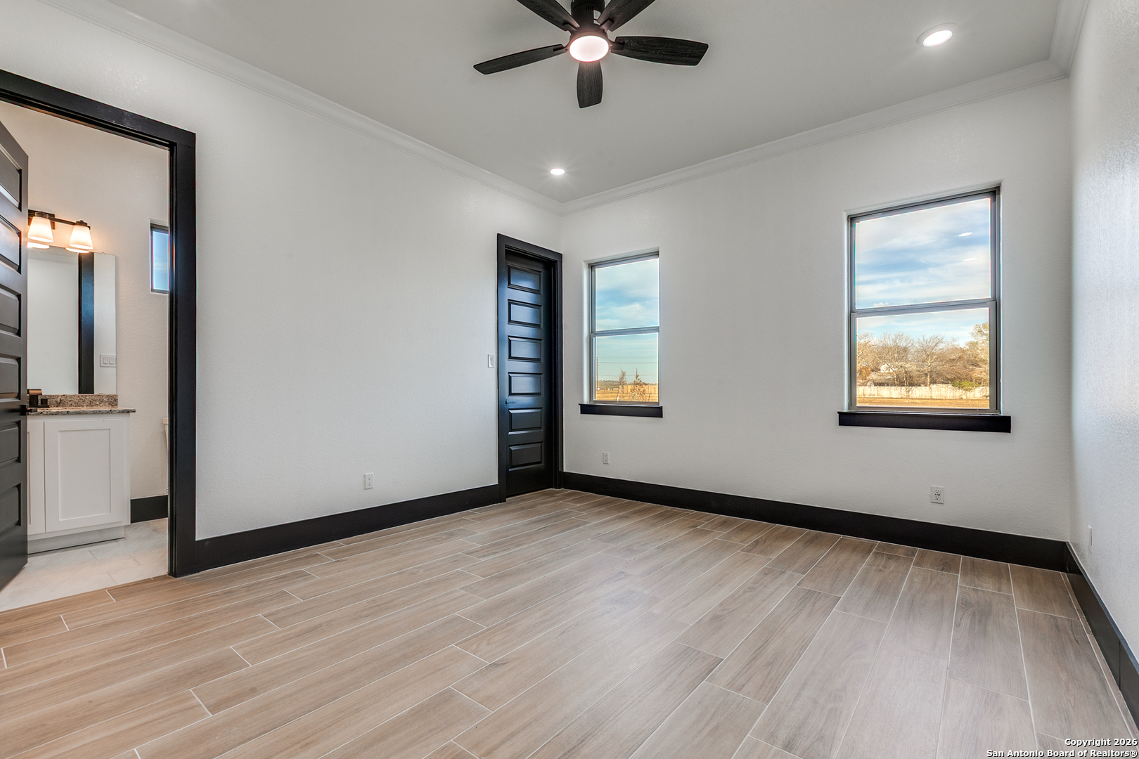 202 Venado Oaks Rio Medina, TX 78066 - Photo 29 of 37 wooden floor in an empty room with a window