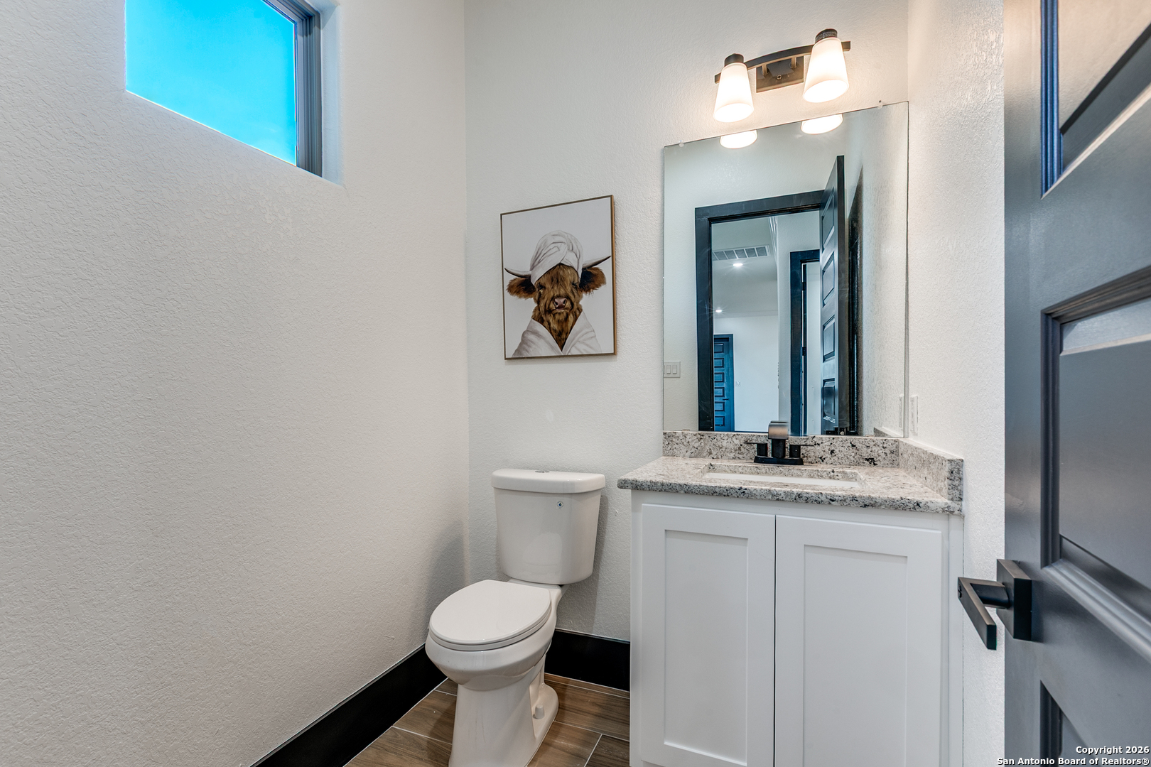 202 Venado Oaks Rio Medina, TX 78066 - Photo 31 of 37 a bathroom with a granite countertop sink toilet and mirror
