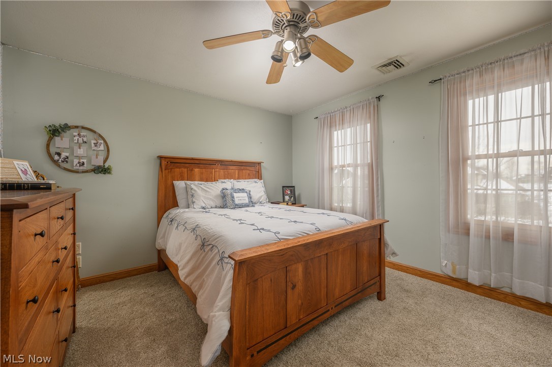 806 Forrest Ridge Drive Dover, OH 44622 - Photo 29 of 36 Bedroom featuring a ceiling fan and light carpet