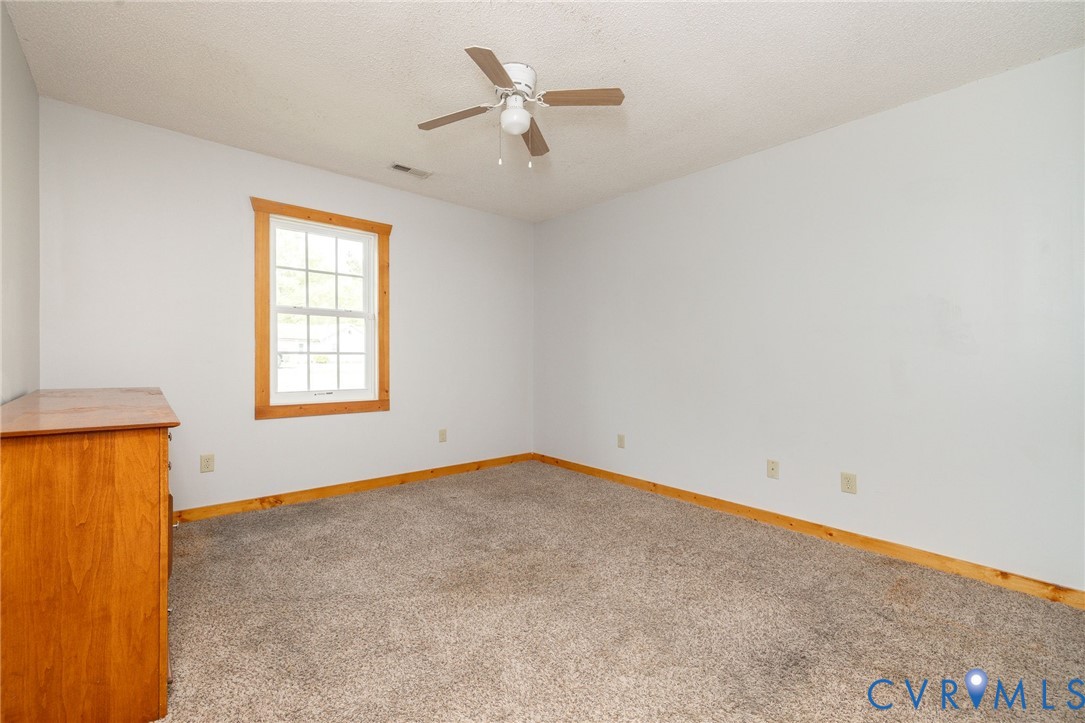 460 Horseshoe Road Jarratt, VA 23867 - Photo 18 of 24 an empty room with a window