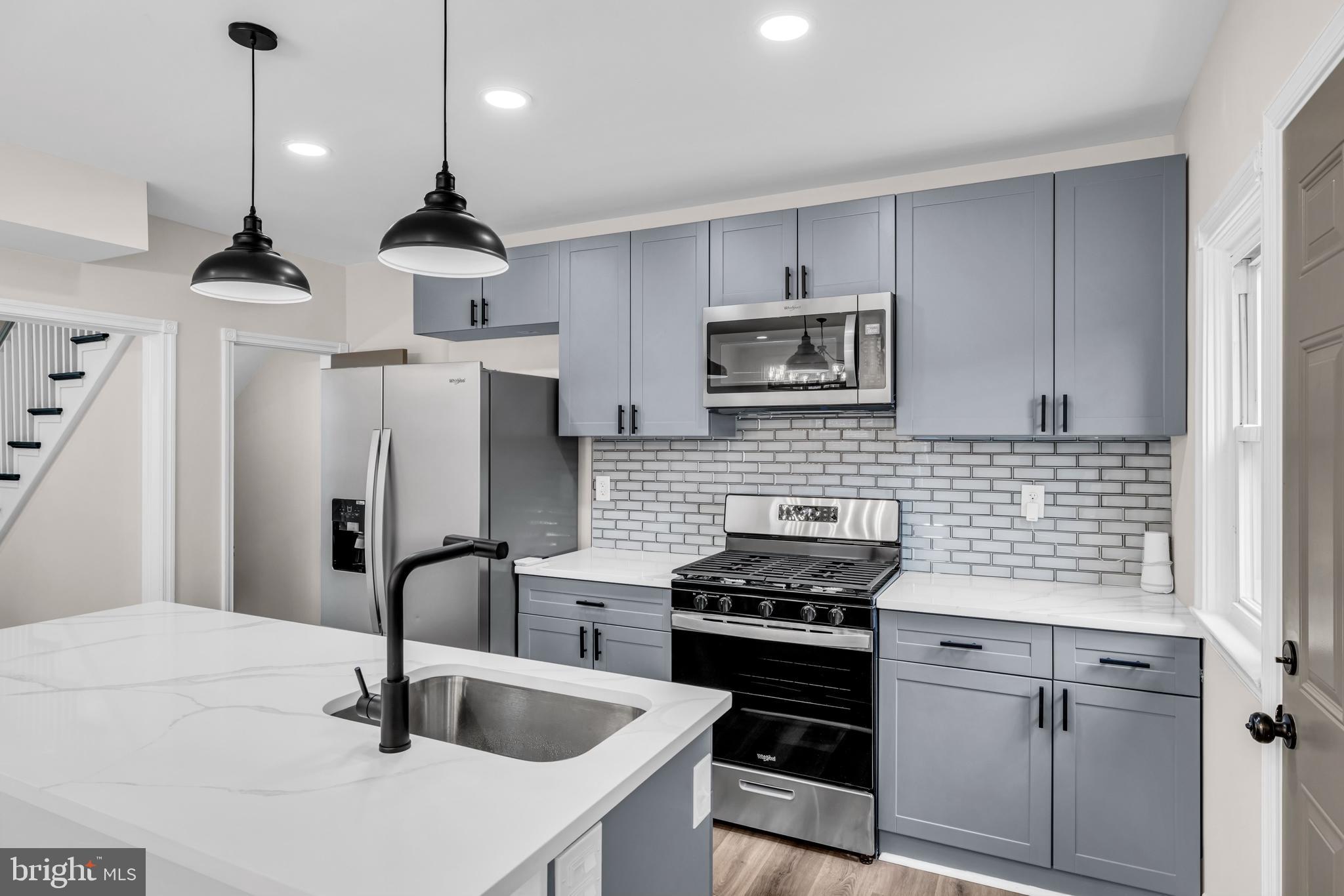 Kitchen with custom cabinets, appliances