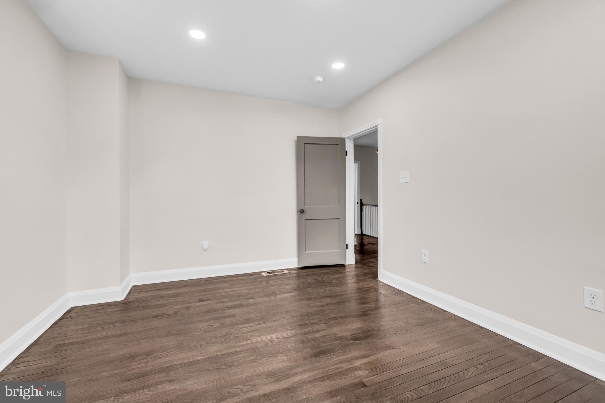 1513 Kingsway Road Baltimore, MD 21218 - Photo 19 of 47 middle bedroom, hardwood floors recess lights
