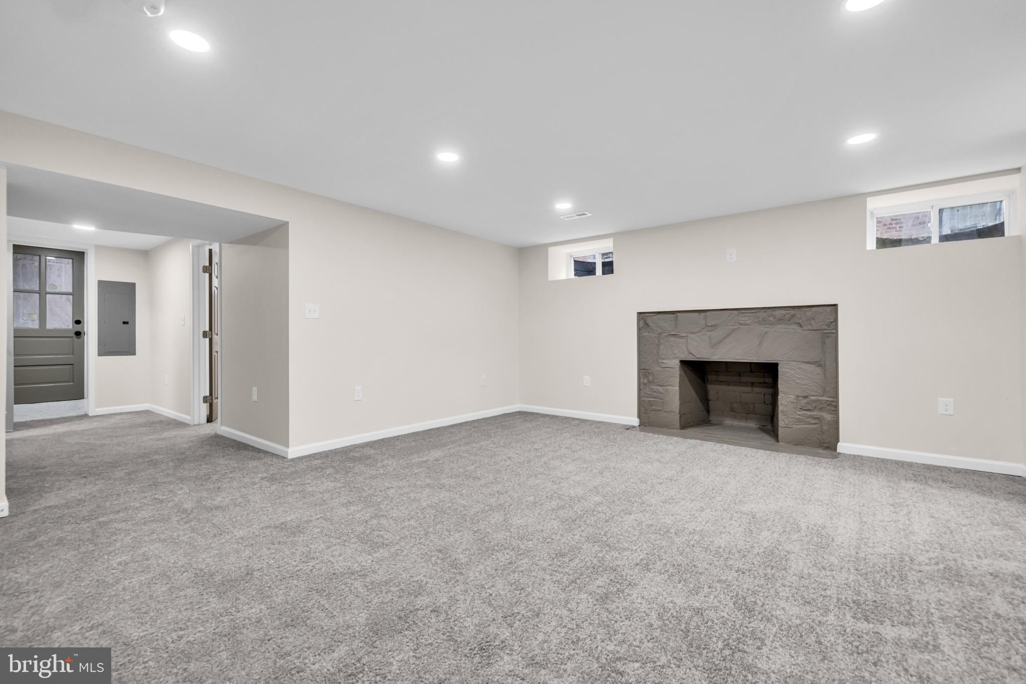 1513 Kingsway Road Baltimore, MD 21218 - Photo 24 of 47 finished basement, brick fire place with carpet
