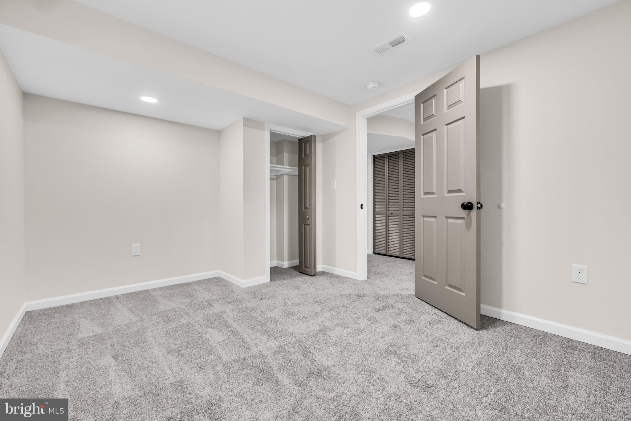 1513 Kingsway Road Baltimore, MD 21218 - Photo 30 of 47 basement room with closet and carpet