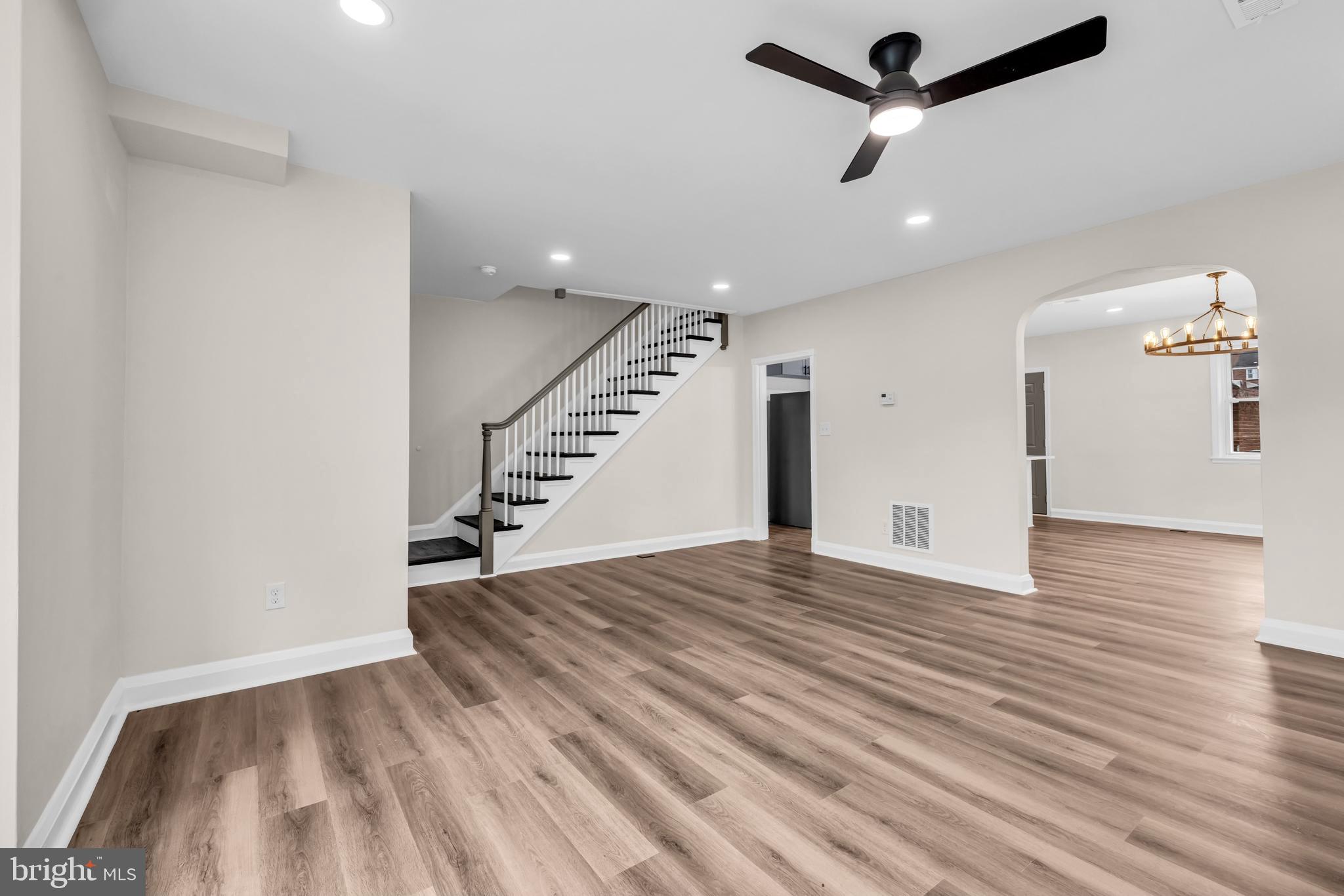 1513 Kingsway Road Baltimore, MD 21218 - Photo 4 of 47 large living room with recess and ceiling fan