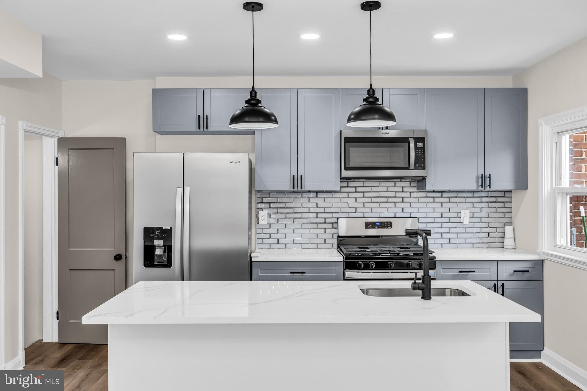 1513 Kingsway Road Baltimore, MD 21218 - Photo 5 of 47 kitchen, quartz counter, pendant light and recess