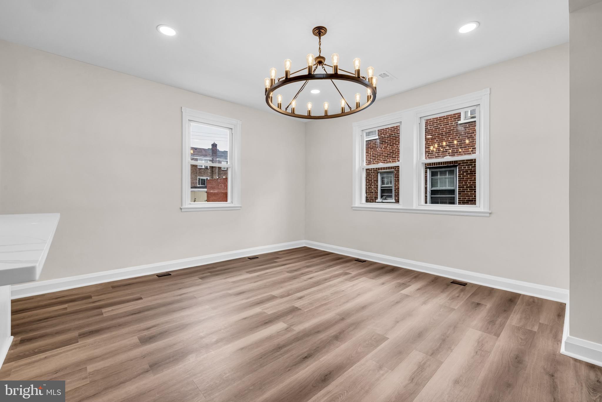 1513 Kingsway Road Baltimore, MD 21218 - Photo 6 of 47 dining room with recess lights and chandelier