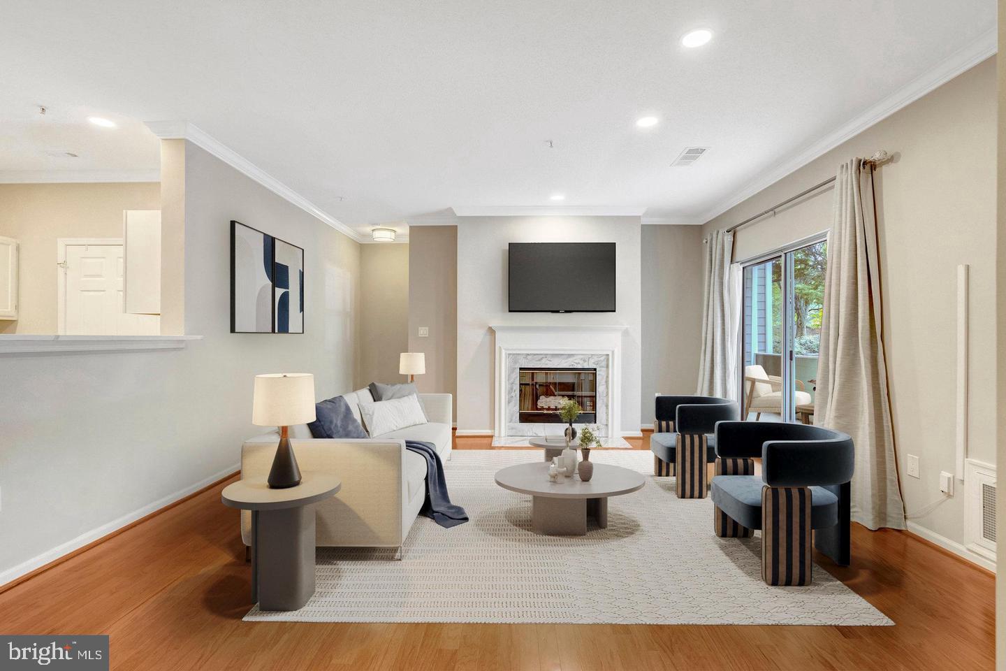 1701 Lake Shore Crest Drive, Unit 11 Reston, VA 20190 - Photo 1 of 33 a living room with furniture and a fireplace