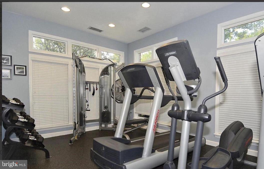 1701 Lake Shore Crest Drive, Unit 11 Reston, VA 20190 - Photo 21 of 33 a view of a room with gym equipment
