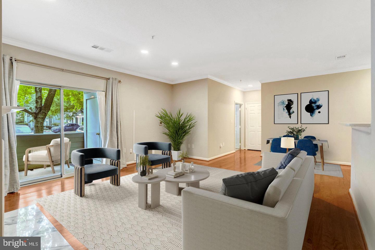 1701 Lake Shore Crest Drive, Unit 11 Reston, VA 20190 - Photo 3 of 33 a living room with furniture and a large window