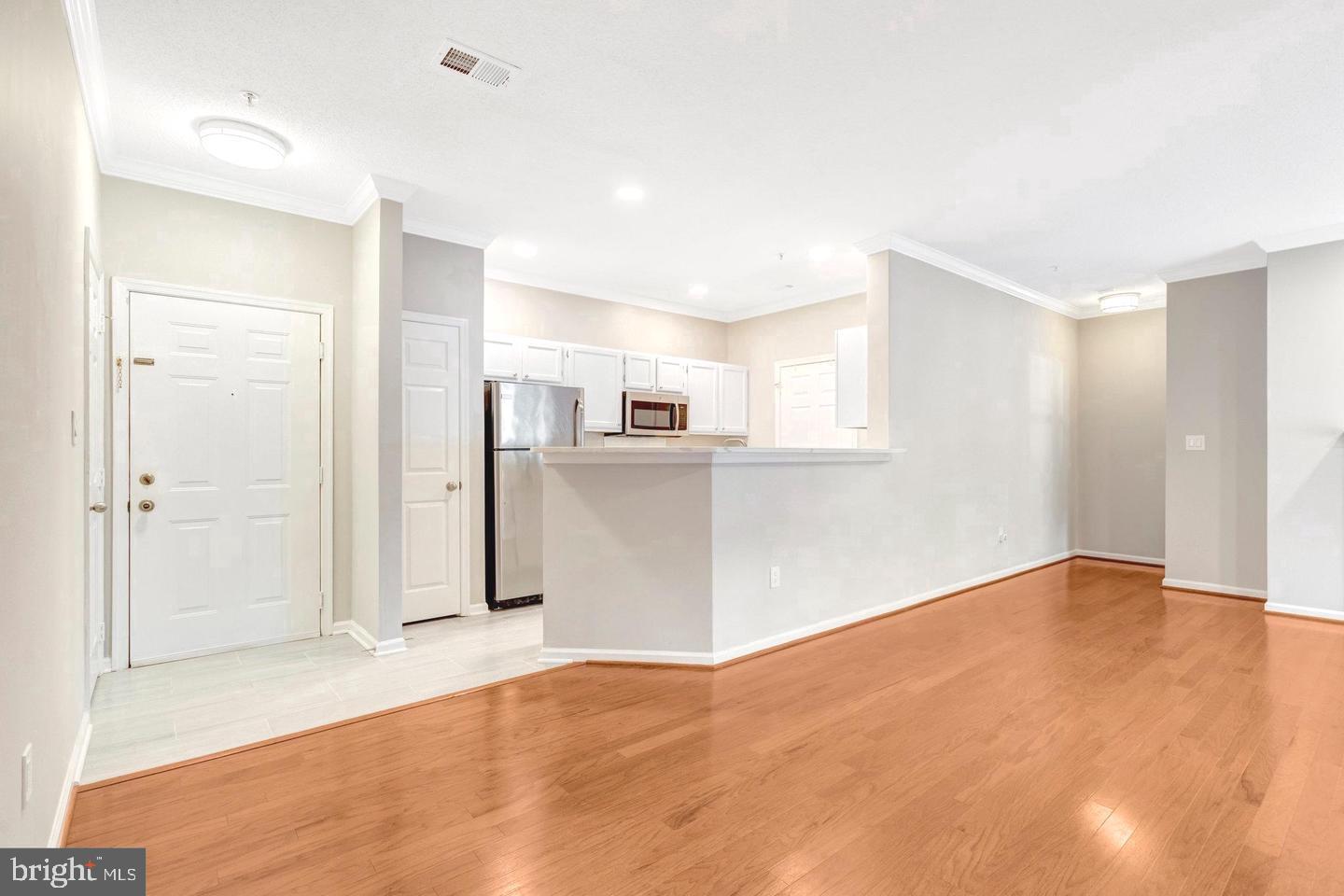 1701 Lake Shore Crest Drive, Unit 11 Reston, VA 20190 - Photo 9 of 33 a view of a kitchen with wooden floor