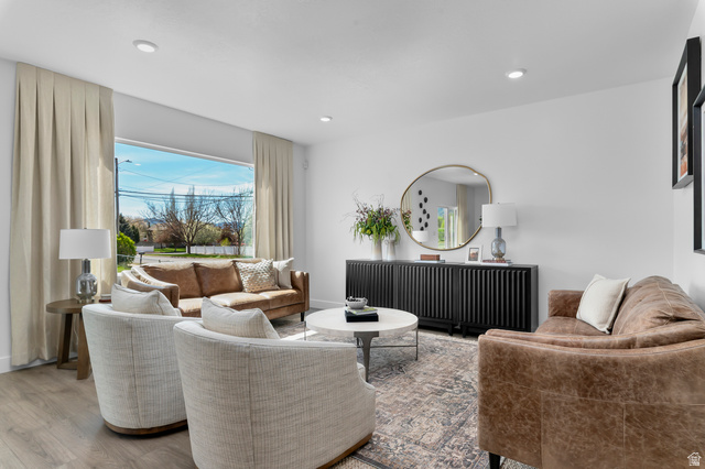 2819 South 710th West, Unit 14 Logan, UT 84321 - Photo 10 of 24 Bright living area featuring wood-finish flooring, recessed lighting, and a large picture window