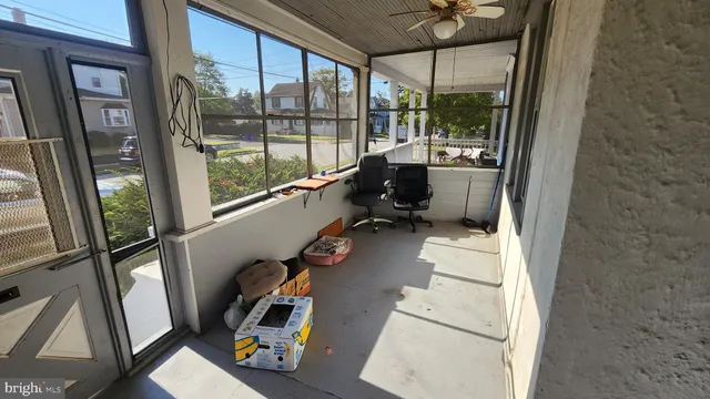 a room with gym equipment and a large window