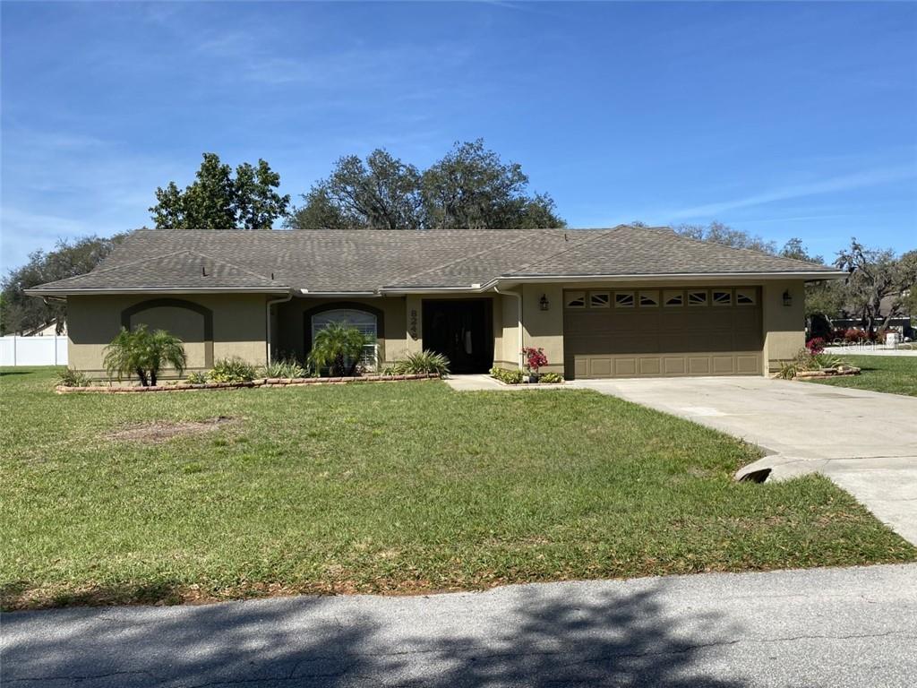 8246 Rangers Path Lakeland, FL 33809 - Photo 1 of 1 a front view of a house with a yard