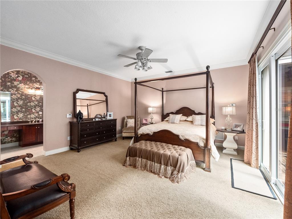 1208 Radiant Street Reunion, FL 34747 - Photo 18 of 47 a bedroom with furniture and a mirror