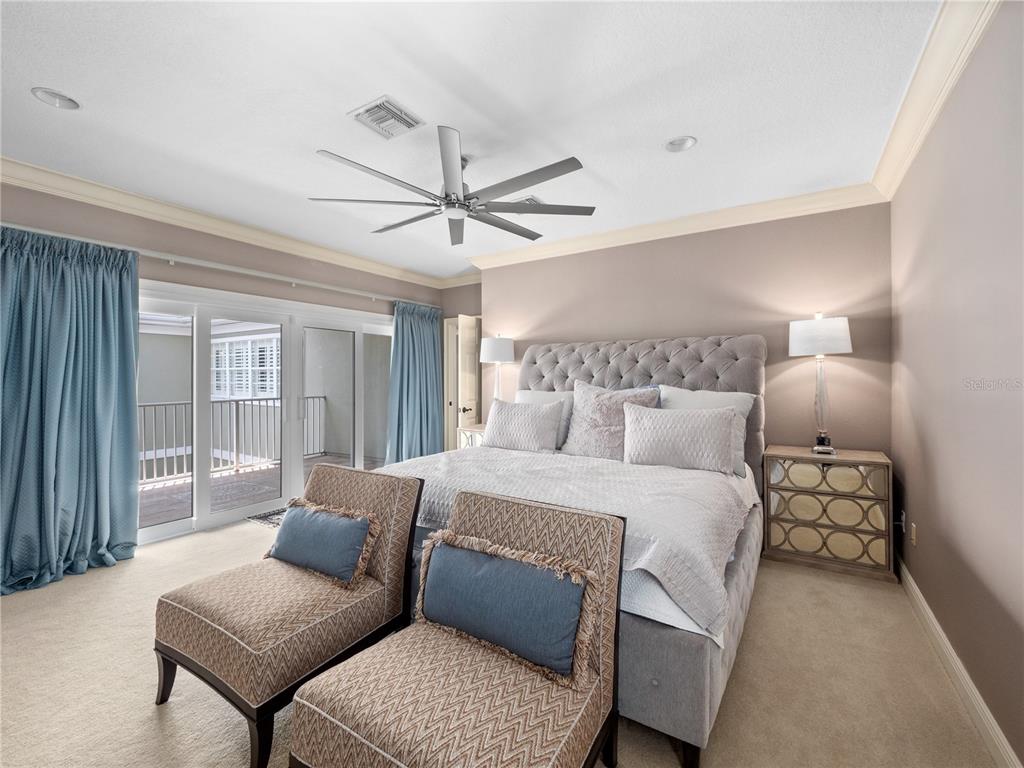 1208 Radiant Street Reunion, FL 34747 - Photo 28 of 47 a bedroom with a bed and a couch