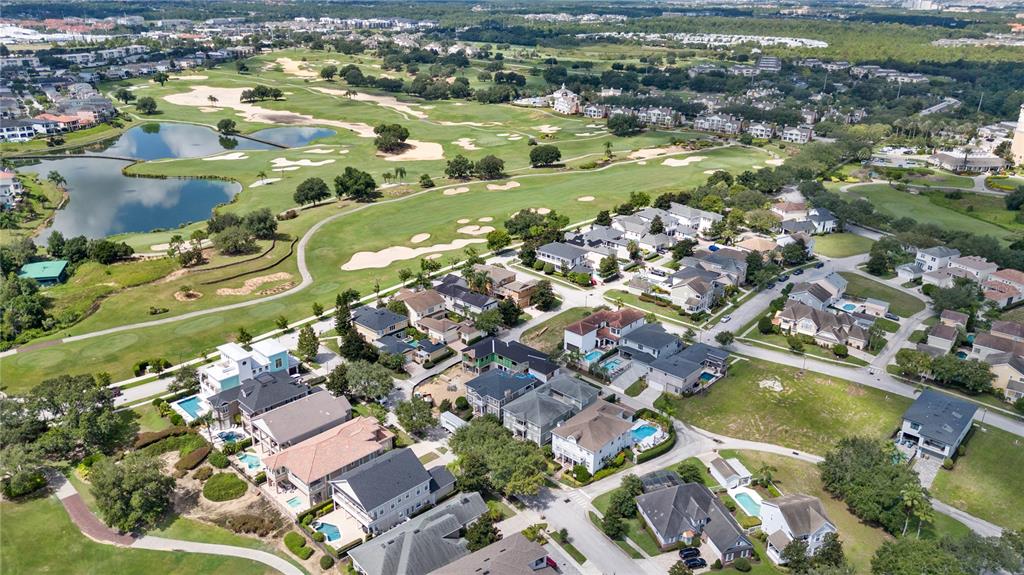1208 Radiant Street Reunion, FL 34747 - Photo 45 of 47 an aerial view of residential houses with outdoor space and swimming pool