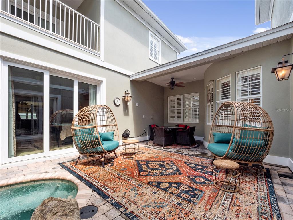 1208 Radiant Street Reunion, FL 34747 - Photo 5 of 47 a front view of a house with patio outdoor seating