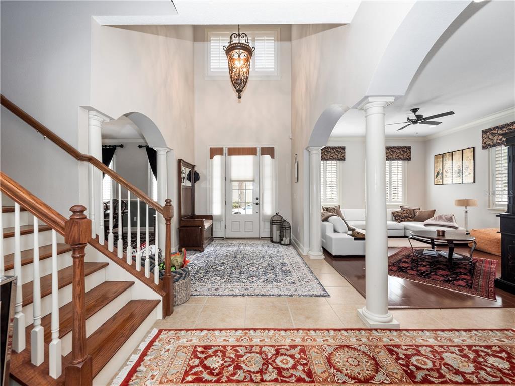1208 Radiant Street Reunion, FL 34747 - Photo 10 of 47 a living room with lots of furniture and a rug