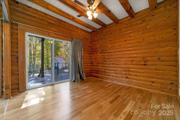 a view of backyard with large windows