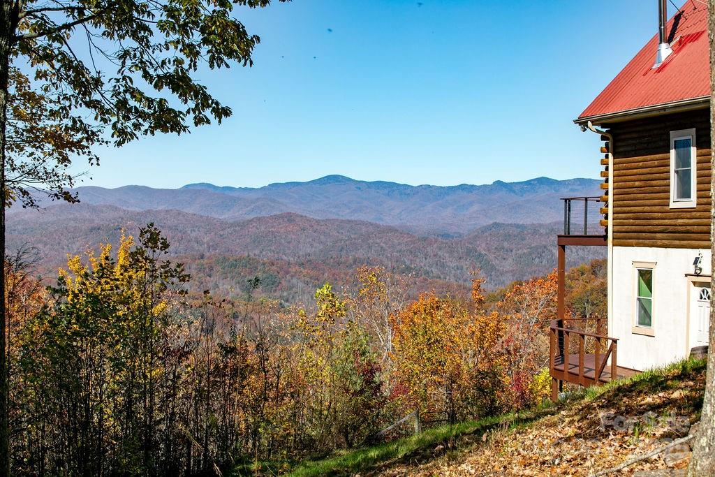 85 Ridge Road Rosman, NC 28772 - Photo 2 of 48 a view of a house with a mountain in the background
