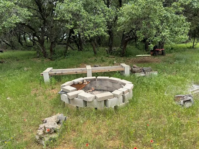 a backyard of a house with yard and outdoor seating