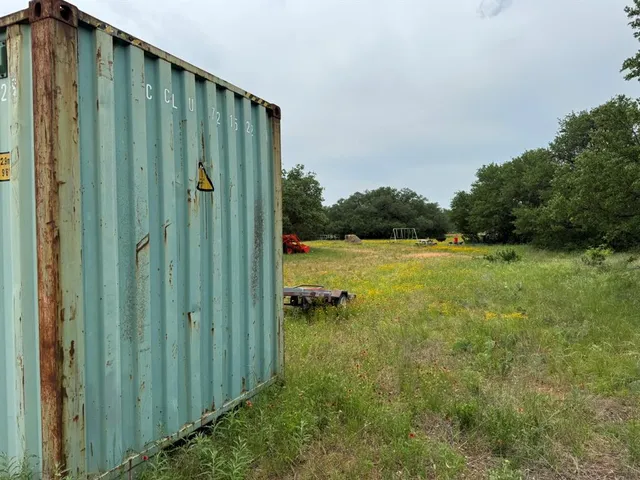 a view of a backyard with garden