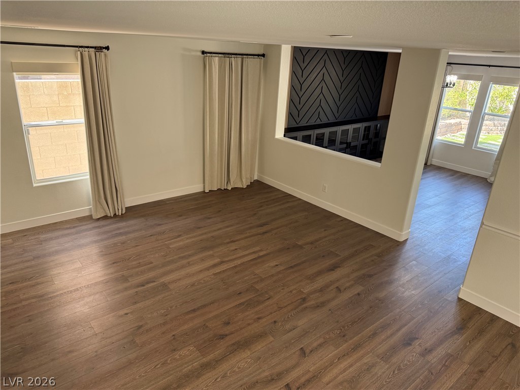 1141 Cathedral Ridge Street Henderson, NV 89052 - Photo 60 of 77 This versatile open-plan area features warm wood flooring and abundant natural light.