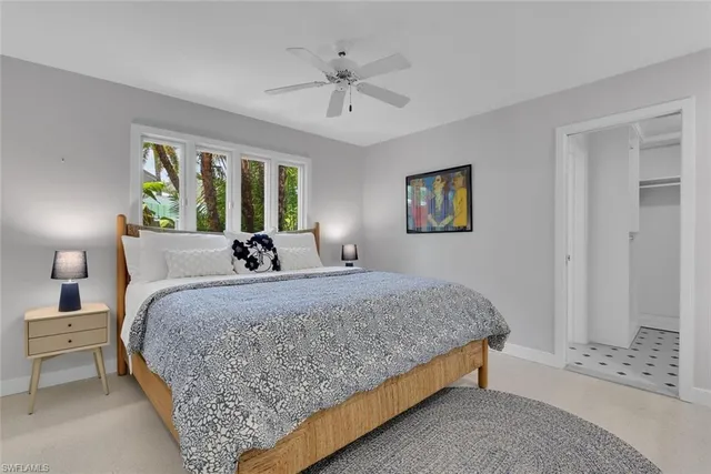 a bed room with a bed and a window