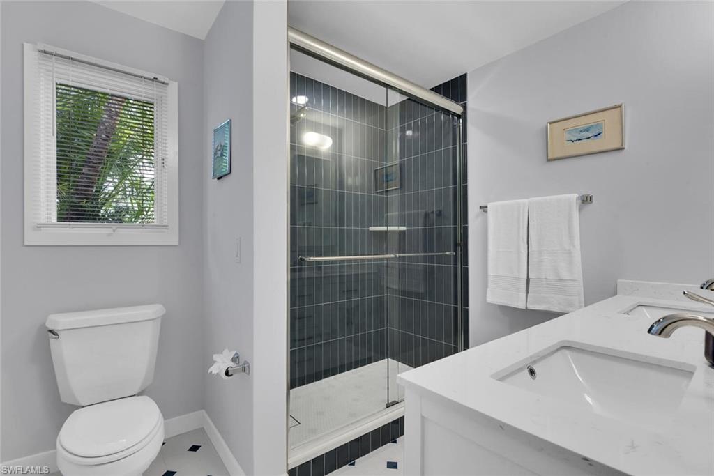 223 11th Avenue South Naples, FL 34102 - Photo 24 of 42 a bathroom with a sink toilet and shower